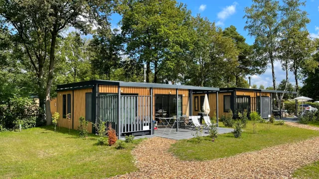 A glamping cottage in an open green space