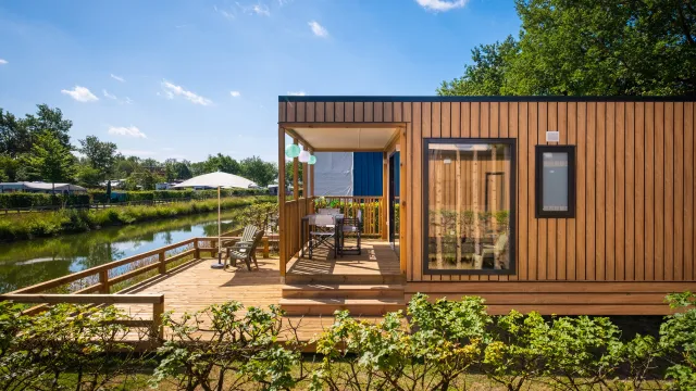 A glamping fish cabin overlooking a fishing pond