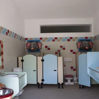 Colorful children's restroom with kangaroo decoration.