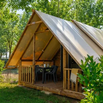 Glamping tent in an open green space