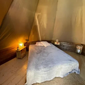 Interior of Tipi tent with double bed
